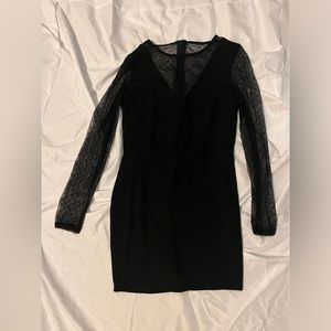 Festive holiday mini dress with sheer long sleeves